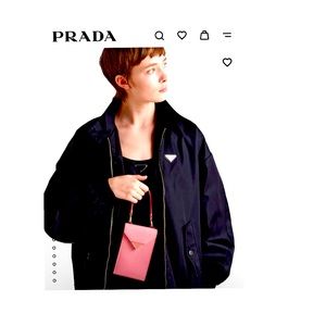 Prada mini-bag with a compact, refined details. Comes with a chain strap.